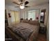 Spacious bedroom with king-size bed and ceiling fan at 1494 W Pawnee Ave, Apache Junction, AZ 85119