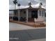 Mobile home with covered patio and seating area at 1494 W Pawnee Ave, Apache Junction, AZ 85119