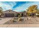 Single-story home with desert landscaping and a two-car garage at 15452 W Skyview Way, Surprise, AZ 85374