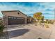 Single-story home with desert landscaping and a two-car garage at 15452 W Skyview Way, Surprise, AZ 85374