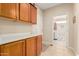 Laundry room with cabinets, counter space and washer/dryer at 15452 W Skyview Way, Surprise, AZ 85374