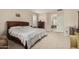 Spacious main bedroom with king-size bed and access to additional rooms at 15452 W Skyview Way, Surprise, AZ 85374