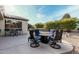 Private backyard patio with seating area and fire pit at 15452 W Skyview Way, Surprise, AZ 85374