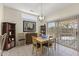 Bright dining area with table and chairs, features a view to the backyard at 15665 W Azalea Ln, Surprise, AZ 85374