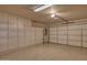 Garage with ample storage and an automatic door opener at 15665 W Azalea Ln, Surprise, AZ 85374