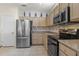 Kitchen features stainless steel appliances and ample counter space at 15665 W Azalea Ln, Surprise, AZ 85374