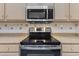 Stainless steel oven with a smooth cooktop at 15665 W Azalea Ln, Surprise, AZ 85374