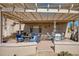 Backyard patio with pergola, seating area, and grill at 15665 W Azalea Ln, Surprise, AZ 85374