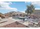 Home with a kidney-shaped pool and relaxing patio area at 17680 W Lilac St, Goodyear, AZ 85338