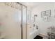 Bathroom with shower and tub, white vanity, and decorative accents at 17680 W Lilac St, Goodyear, AZ 85338