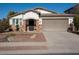 Single-story home with a two-car garage and landscaped front yard at 17680 W Lilac St, Goodyear, AZ 85338