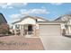 One-story home with a two-car garage and desert landscaping at 17680 W Lilac St, Goodyear, AZ 85338