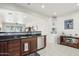 Kitchen features granite countertops, dark wood cabinets, and stainless steel appliances at 17680 W Lilac St, Goodyear, AZ 85338