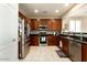 Well-equipped kitchen with ample counter space and wood cabinets at 17680 W Lilac St, Goodyear, AZ 85338