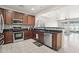 Modern kitchen with stainless steel appliances and wood cabinets at 17680 W Lilac St, Goodyear, AZ 85338