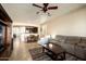 Open living room with seating and a view into the dining area and kitchen at 17680 W Lilac St, Goodyear, AZ 85338