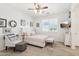 Main bedroom with a queen bed, white and pink decor, and a walk-in closet at 17680 W Lilac St, Goodyear, AZ 85338