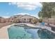 Refreshing kidney-shaped pool with a patio and lounge chairs at 17680 W Lilac St, Goodyear, AZ 85338