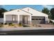 Single-story home with gray garage door and landscaping at 17697 W Southgate Ave, Goodyear, AZ 85338