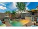 Inviting backyard oasis with a sparkling pool and patio area at 1806 E Ellis St, Phoenix, AZ 85042