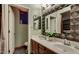 Double vanity bathroom with large mirror and plants at 1806 E Ellis St, Phoenix, AZ 85042