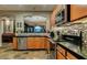 Modern kitchen with stainless steel appliances and dark countertops at 1806 E Ellis St, Phoenix, AZ 85042