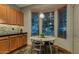 Kitchen nook with wood cabinets and tile flooring at 1806 E Ellis St, Phoenix, AZ 85042