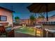 Relaxing backyard pool with a bar and comfortable seating at 1806 E Ellis St, Phoenix, AZ 85042