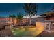 Backyard pool and patio area with a bar and water feature at 1806 E Ellis St, Phoenix, AZ 85042