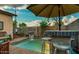 Inviting backyard pool area with a bar and patio furniture at 1806 E Ellis St, Phoenix, AZ 85042