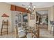 Bright dining area with glass top table and access to patio at 18137 N Estrella Vista Dr, Surprise, AZ 85374