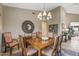 Bright dining room featuring a wood table and stylish chairs at 18137 N Estrella Vista Dr, Surprise, AZ 85374