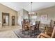 Well-lit dining room with access to the living room at 18137 N Estrella Vista Dr, Surprise, AZ 85374