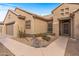 House with a walkway to the entrance and desert landscaping at 18137 N Estrella Vista Dr, Surprise, AZ 85374