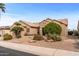 Single-story home with desert landscaping and a two-car garage at 18137 N Estrella Vista Dr, Surprise, AZ 85374