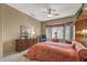 Main bedroom with king-size bed and built-in shelving at 18137 N Estrella Vista Dr, Surprise, AZ 85374