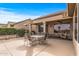 Patio features seating area and partial golf course view at 18137 N Estrella Vista Dr, Surprise, AZ 85374