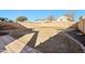 Large backyard area with a tall block fence for privacy and security at 18260 W Bridger St, Surprise, AZ 85388