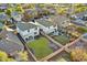 Aerial view of backyard with a large grassy area, patio, and wooden fence at 18260 W Bridger St, Surprise, AZ 85388