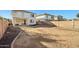 Spacious backyard featuring a blank canvas for landscaping or outdoor activities at 18260 W Bridger St, Surprise, AZ 85388