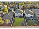 Aerial view of backyard with patio, grass, and wood fence at 18260 W Bridger St, Surprise, AZ 85388