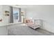 Bright Bedroom with gray carpet, window and a white crib at 18260 W Bridger St, Surprise, AZ 85388