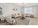 Relaxing living room showcasing comfortable seating, natural light, and a chic, minimalist design at 18260 W Bridger St, Surprise, AZ 85388