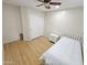 Small bedroom with hardwood floors and white bedding at 18803 N 16Th Pl, Phoenix, AZ 85024