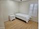 Small bedroom with hardwood floors and white bedding at 18803 N 16Th Pl, Phoenix, AZ 85024