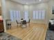 Bright dining area with hardwood floors and white table at 18803 N 16Th Pl, Phoenix, AZ 85024