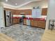 Modern kitchen with stainless steel appliances and wood cabinets at 18803 N 16Th Pl, Phoenix, AZ 85024