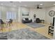 Hardwood floor living room with gray couch and seating at 18803 N 16Th Pl, Phoenix, AZ 85024