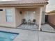 Cozy patio with seating area, adjacent to the pool at 18803 N 16Th Pl, Phoenix, AZ 85024