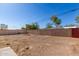 The backyard is enclosed by a combination of brick and chainlink fence, providing security at 1940 S Coconino Dr, Apache Junction, AZ 85120